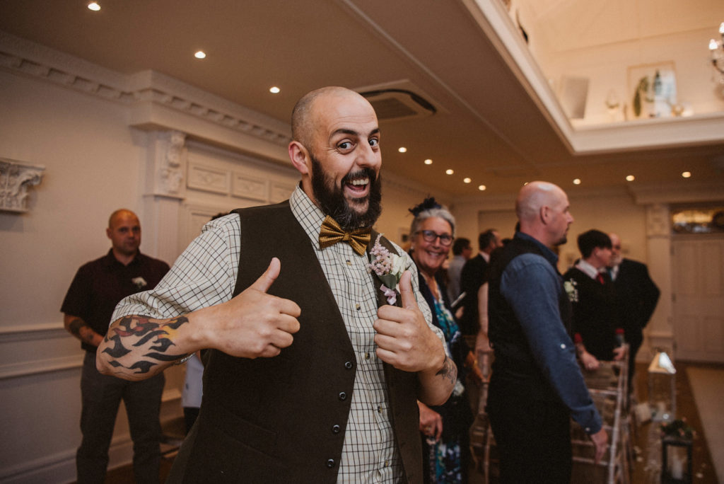 Groom gives the thumbs up prior to the wedding ceremony