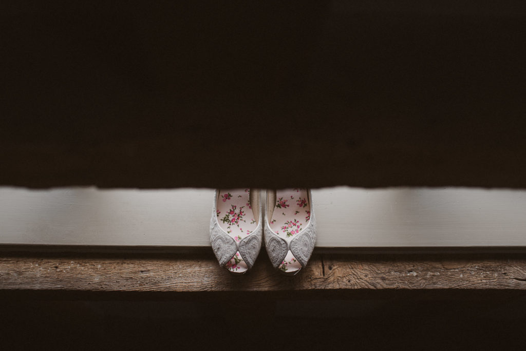 Surrey bride's shoes sitting on windowsill