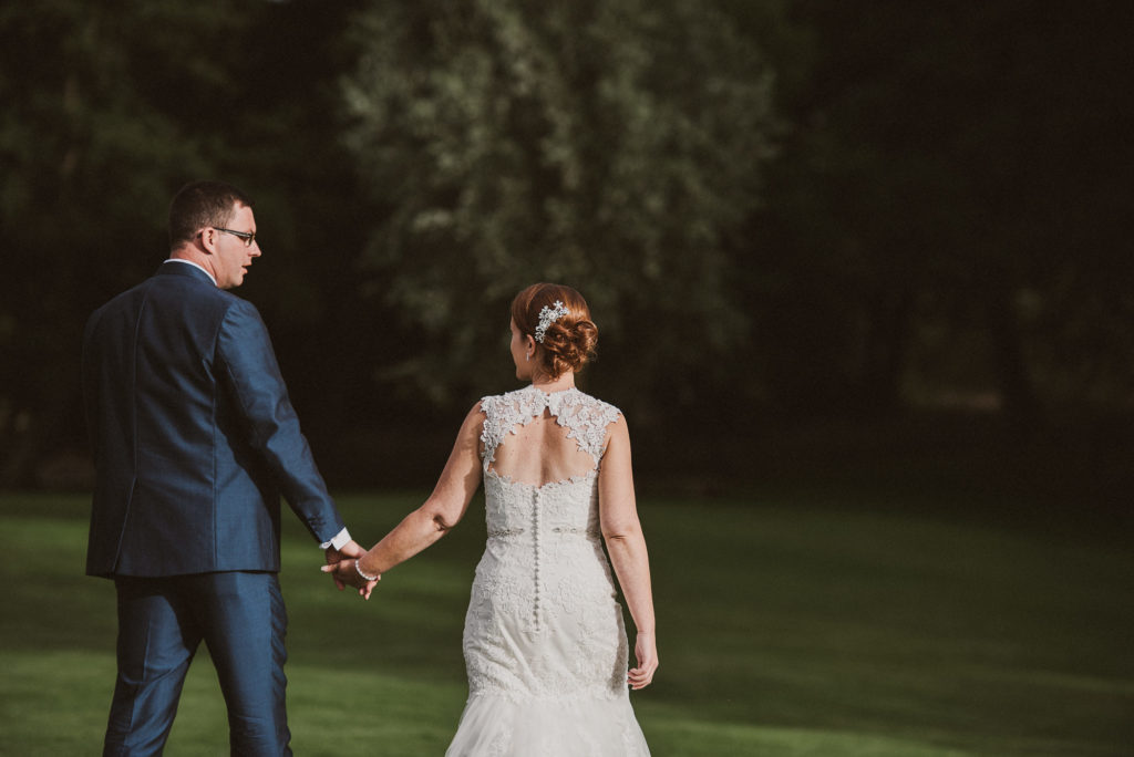 bride and groom go for a relaxed walk