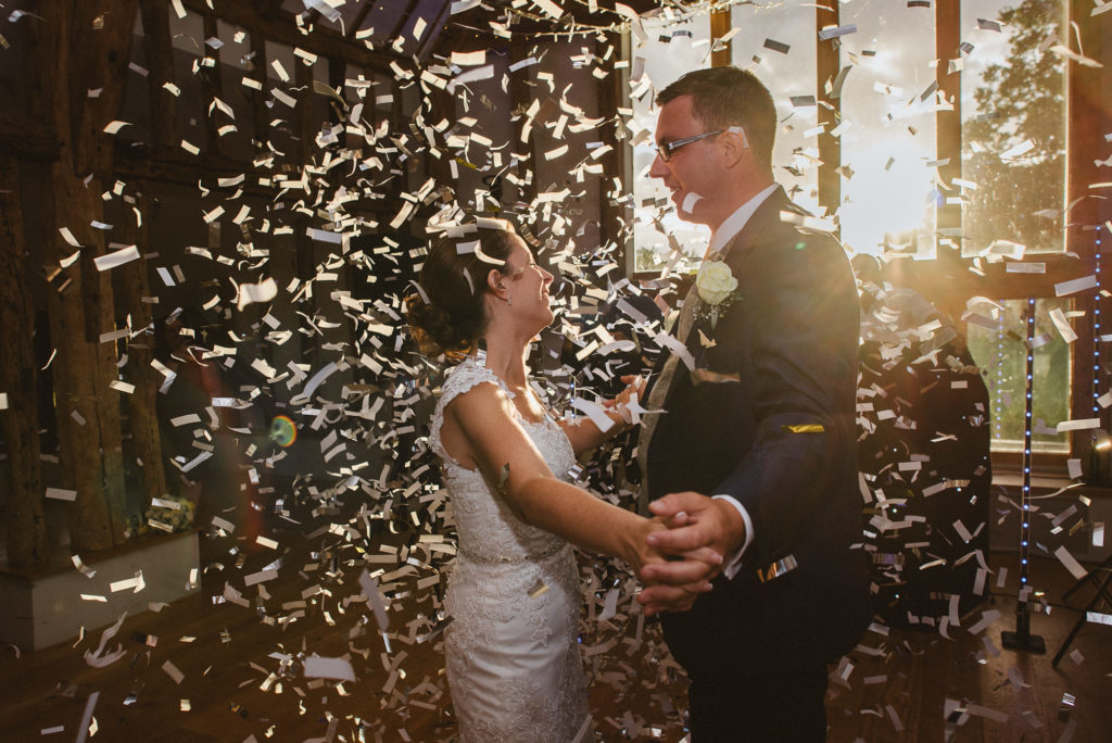 Surrey bride and groom react to the large amount of confetti during their first dance
