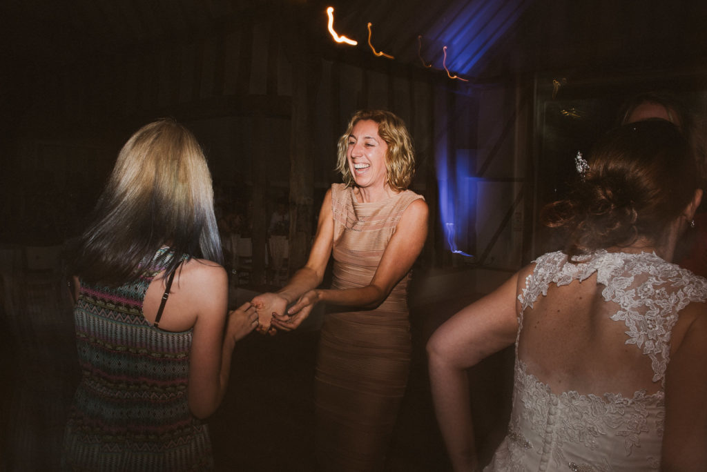 wedding guests having fun during a barn wedding reception