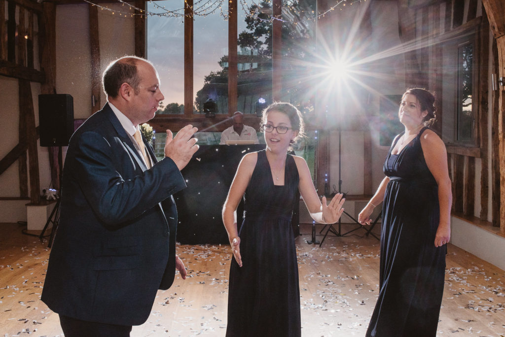 wedding guests do the robot during a barn wedding reception