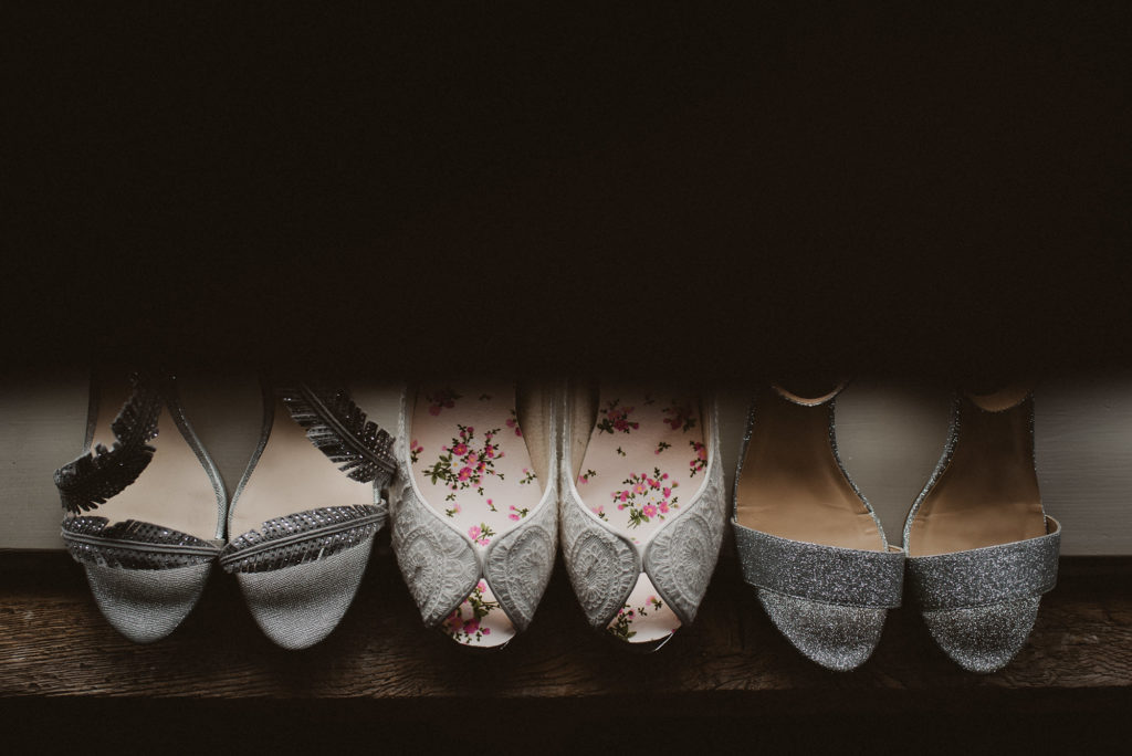 brides and bridesmaids shoes sitting on windowsill