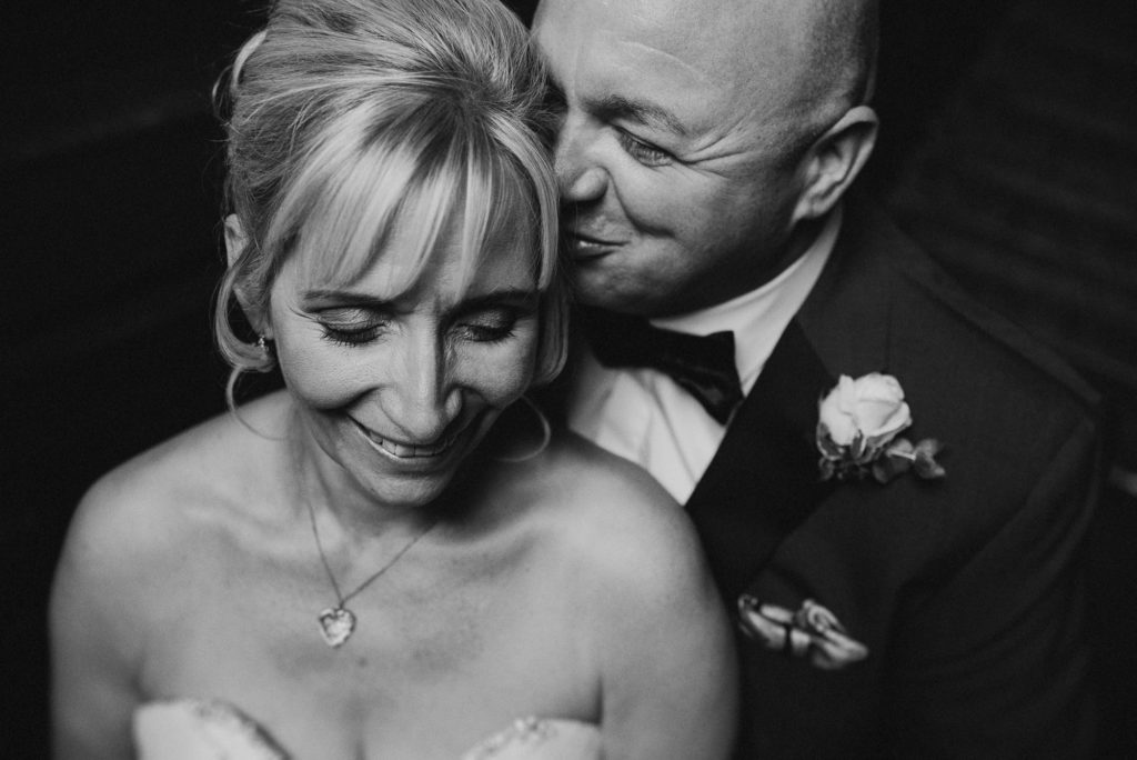 London groom kisses laughing bride