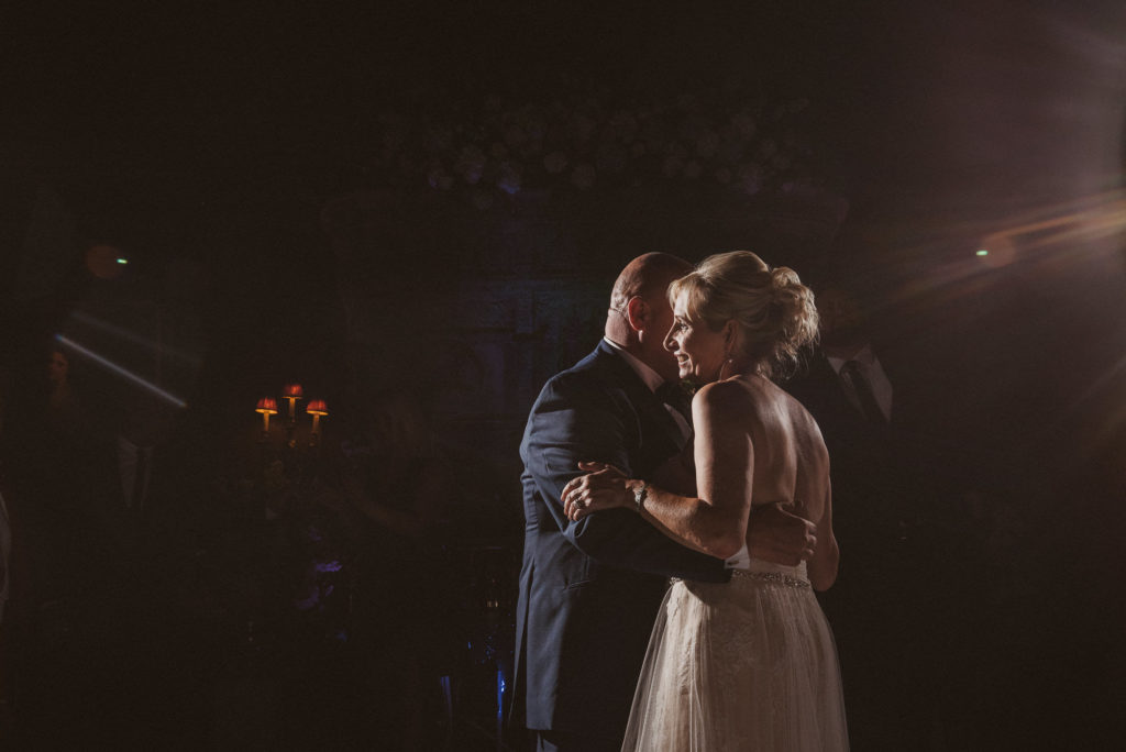 bride and groom have their first dance during their wedding reception in the Great Hall