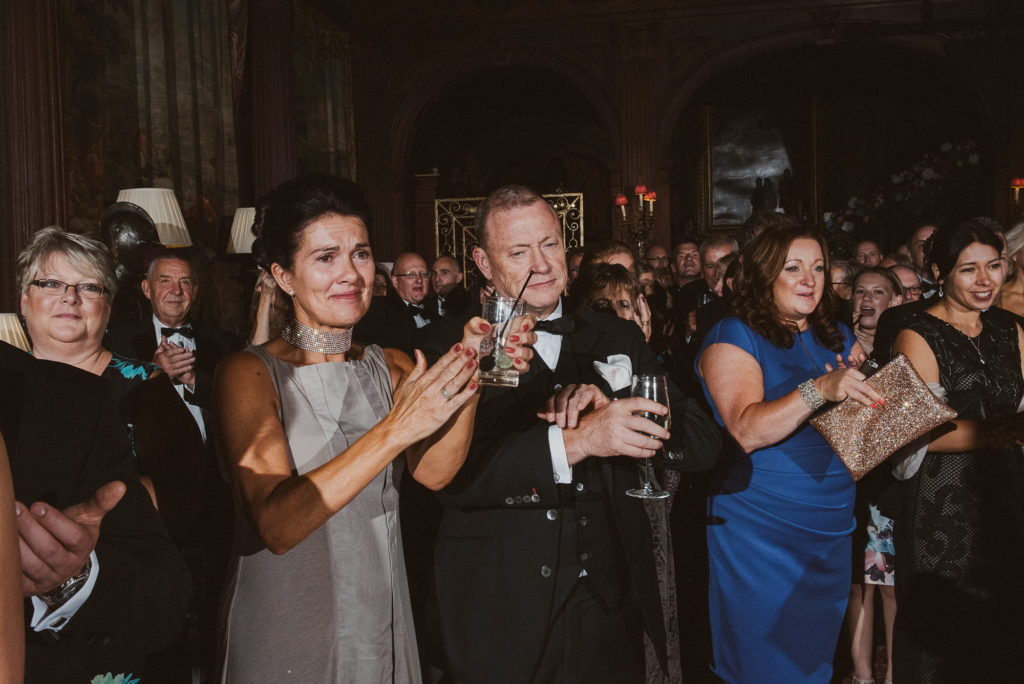 wedding guests congratulate the bride and groom during their first dance