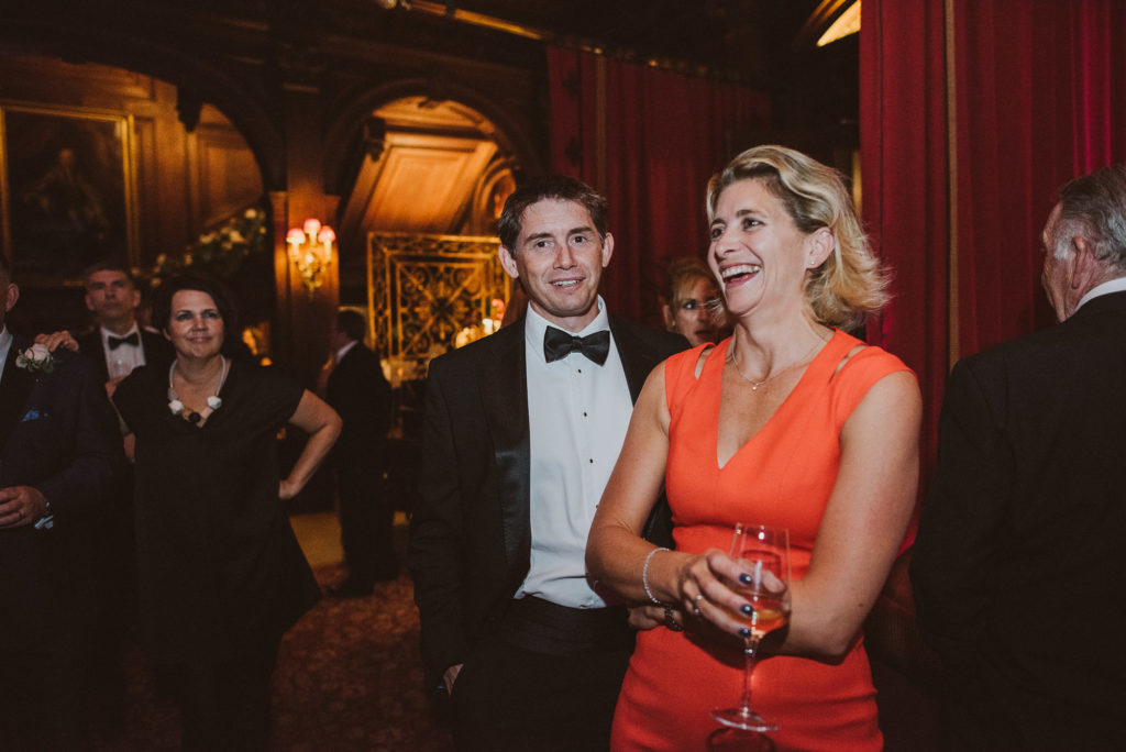 wedding guest laughs at a joke in the Great Hall